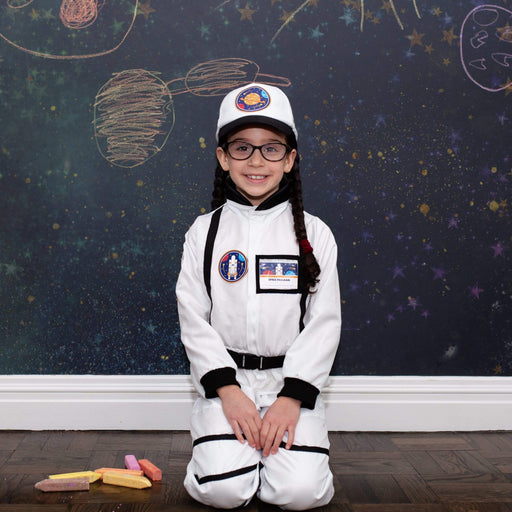 a young child wearing the astronaut suit