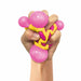 a hand squeezing the atomic nee doh toy