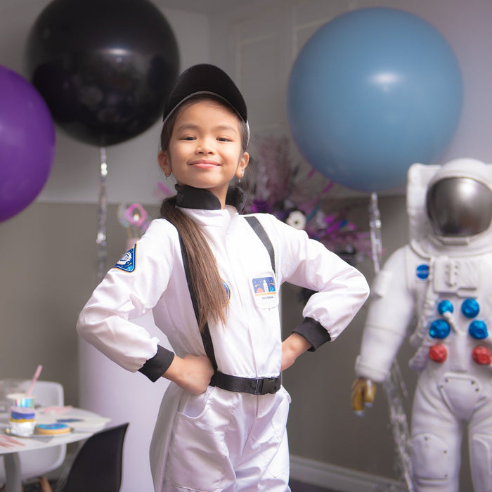 a young child wearing the astronaut suit